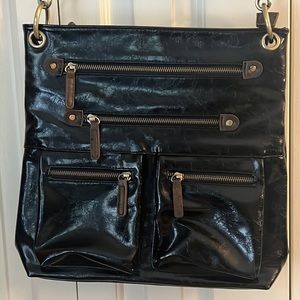 Faux leather cross body bag. Brand is shiraleah.